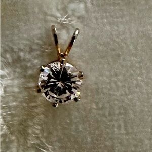 Elegant Gold and clear gemstone charm/pendant